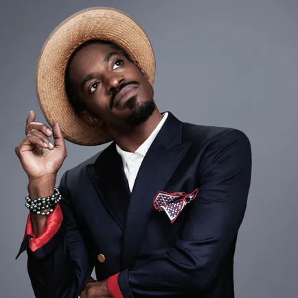 Andre 3000 in suit and hat